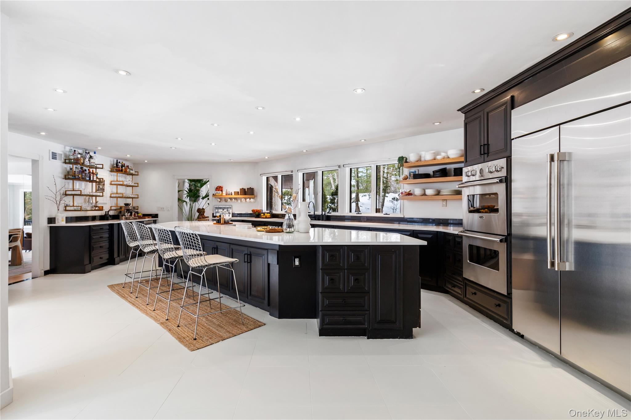 205 Polly Park Road Rye, NY 10580 - Photo 10 of 33 a kitchen with stainless steel appliances kitchen island granite countertop a refrigerator and a stove top oven