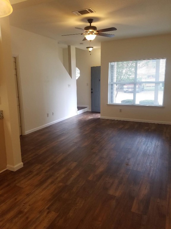200 Riverbend Drive Georgetown, TX 78628 - Photo 13 of 17 an empty room with wooden floor and windows