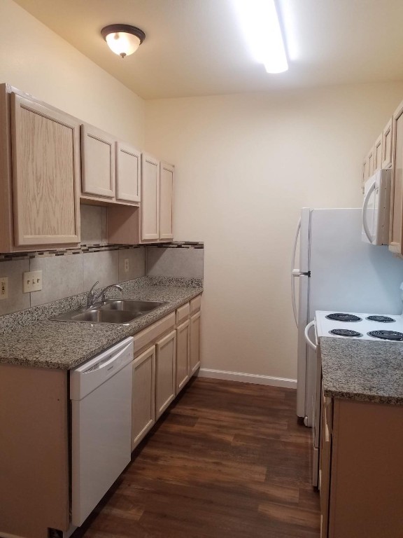 200 Riverbend Drive Georgetown, TX 78628 - Photo 3 of 17 a kitchen with stainless steel appliances granite countertop a sink stove and refrigerator