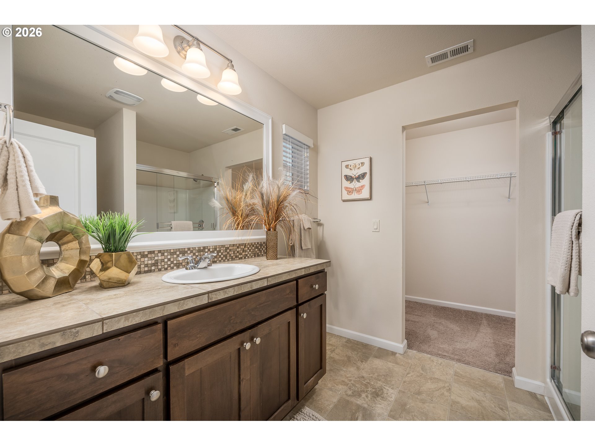2976 Northwest Persimmon Way Albany, OR 97321 - Photo 14 of 29 a bathroom with a granite countertop sink a mirror and a shower
