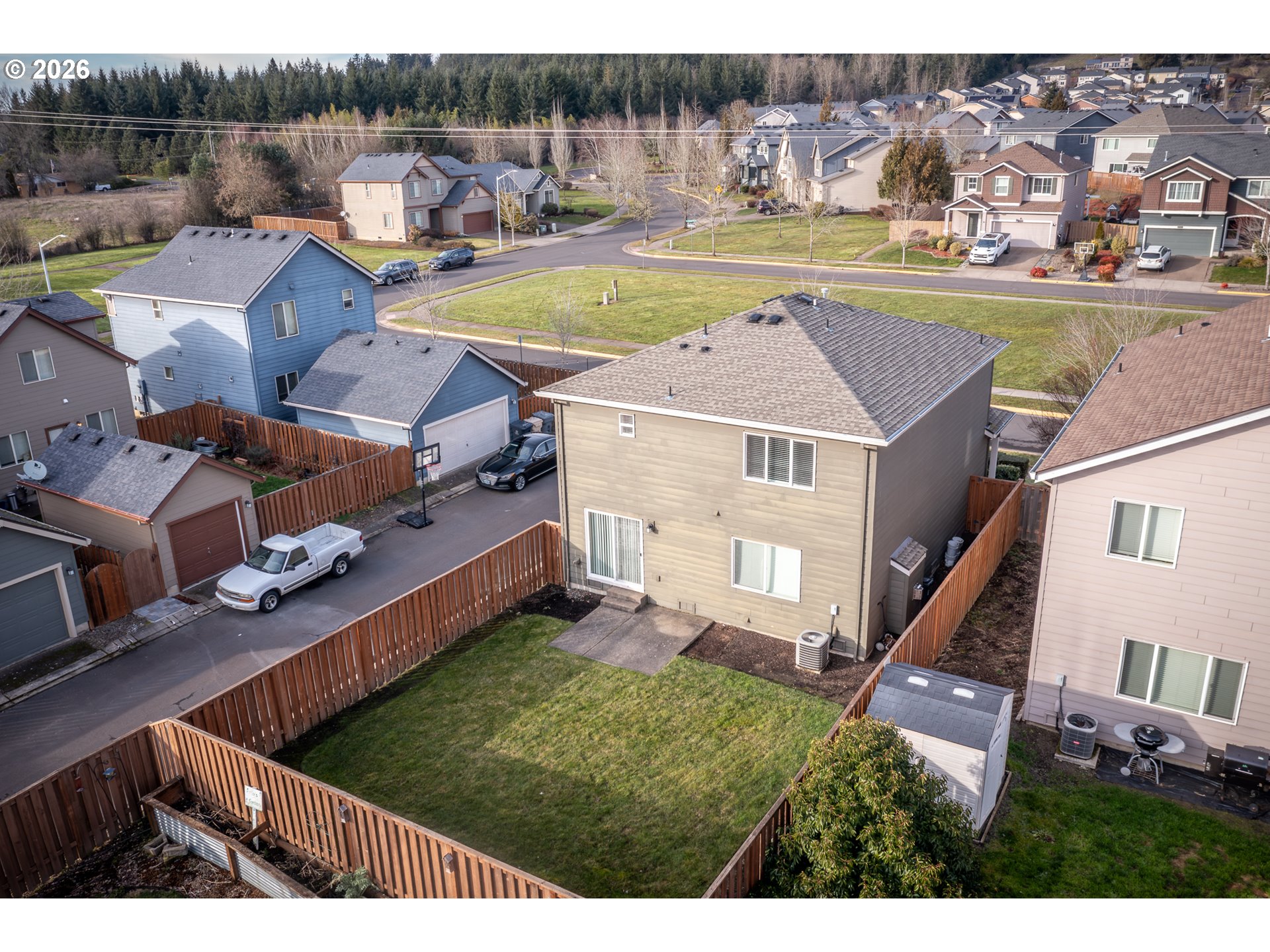 2976 Northwest Persimmon Way Albany, OR 97321 - Photo 28 of 29 a view of a house with pool and a yard