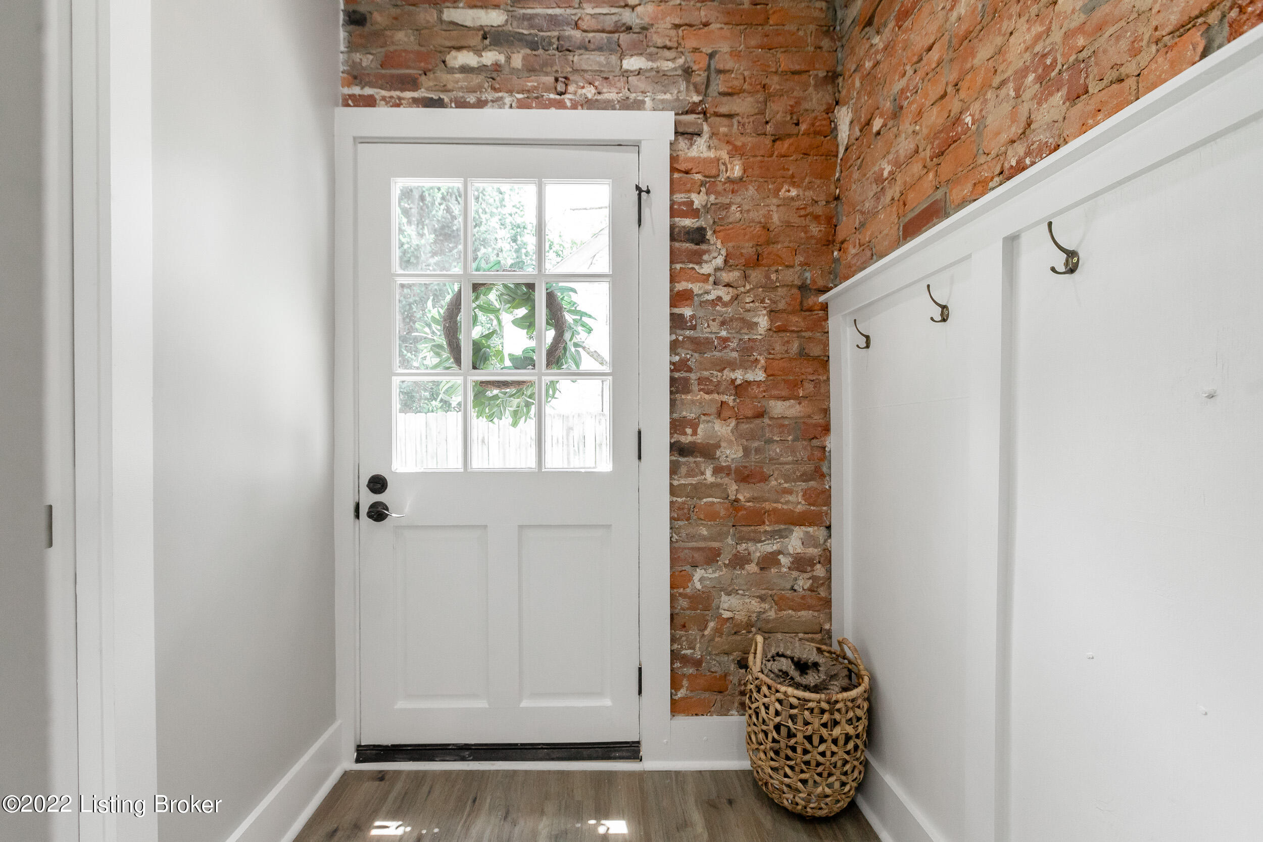 4204 Dover Road Louisville, KY 40216 - Photo 28 of 59 exposed brick and new board-and-batten by the side door entrance