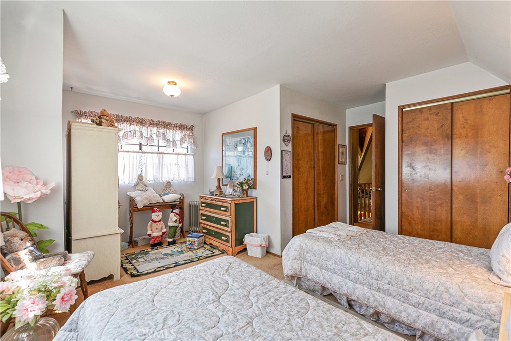 329 Grass Valley Road Lake Arrowhead, CA 92352 - Photo 19 of 31 a bedroom with a bed and a window