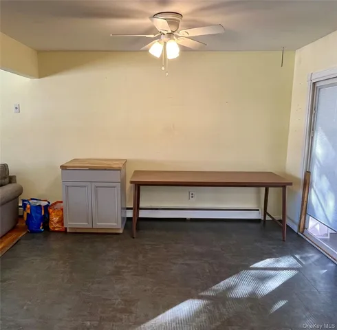 a view of room with stairs and a chandelier fan
