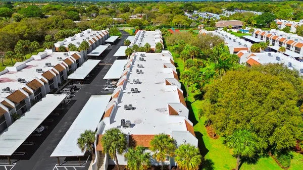 an aerial view of residential houses with outdoor space