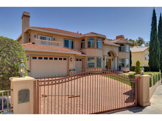 a front view of a house with a fence
