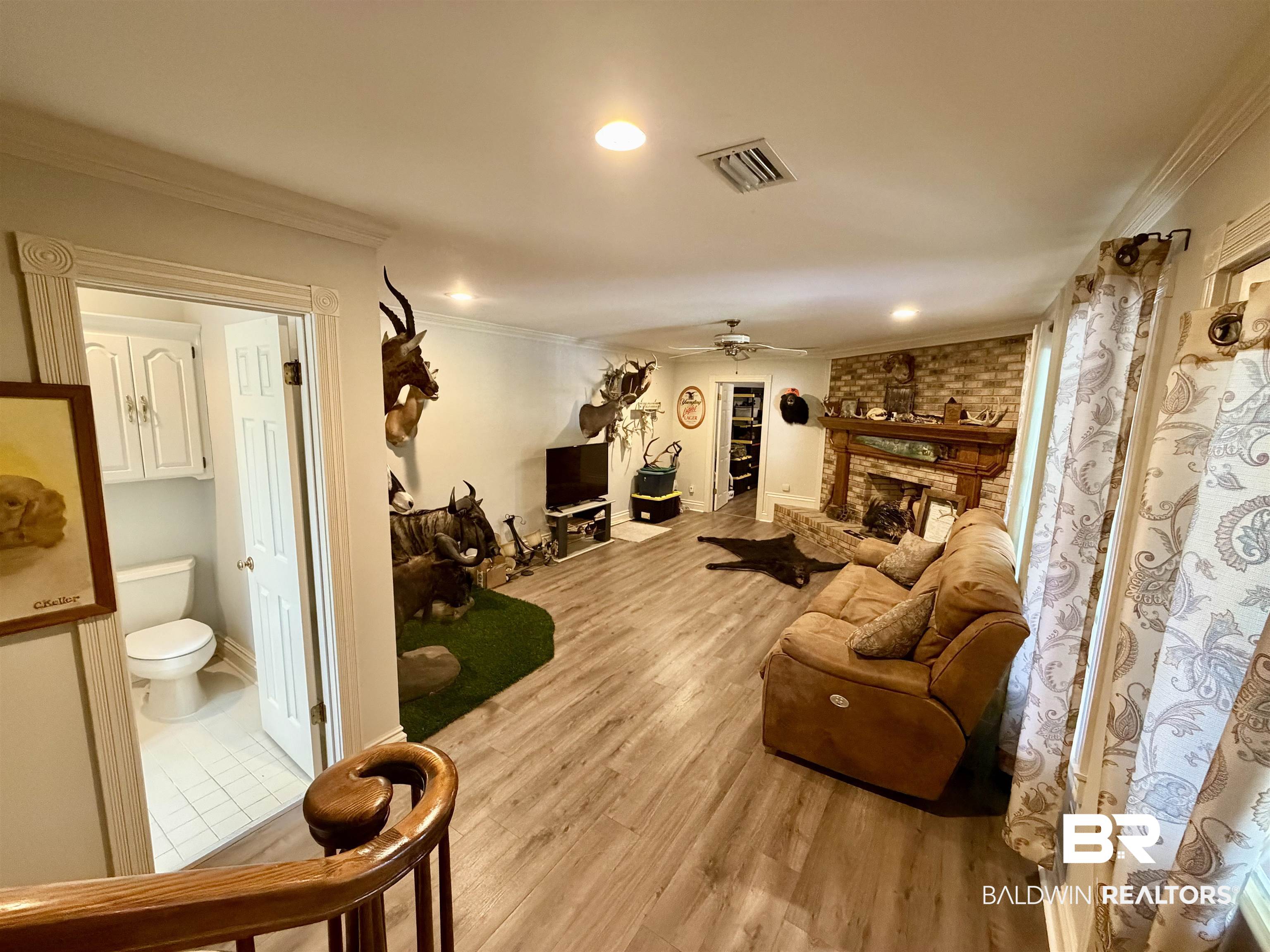 2944 Appleton Road Brewton, AL 36426 - Photo 37 of 65 Living area with ornamental molding, a ceiling fan, recessed lighting, light wood finished floors, and a large fireplace