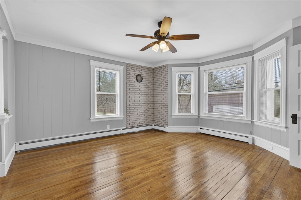 22 Maple Street Templeton, MA 01436 - Photo 12 of 28 a view of an empty room with wooden floor and a window