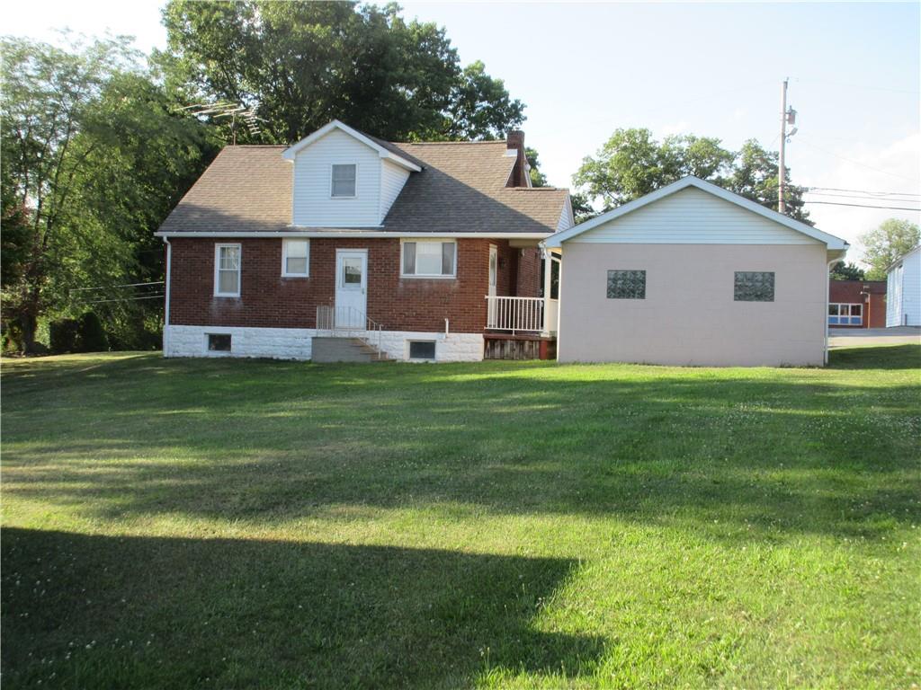107 Blakely Road Butler, PA 16002 - Photo 19 of 25 a front view of a house with a yard and garage