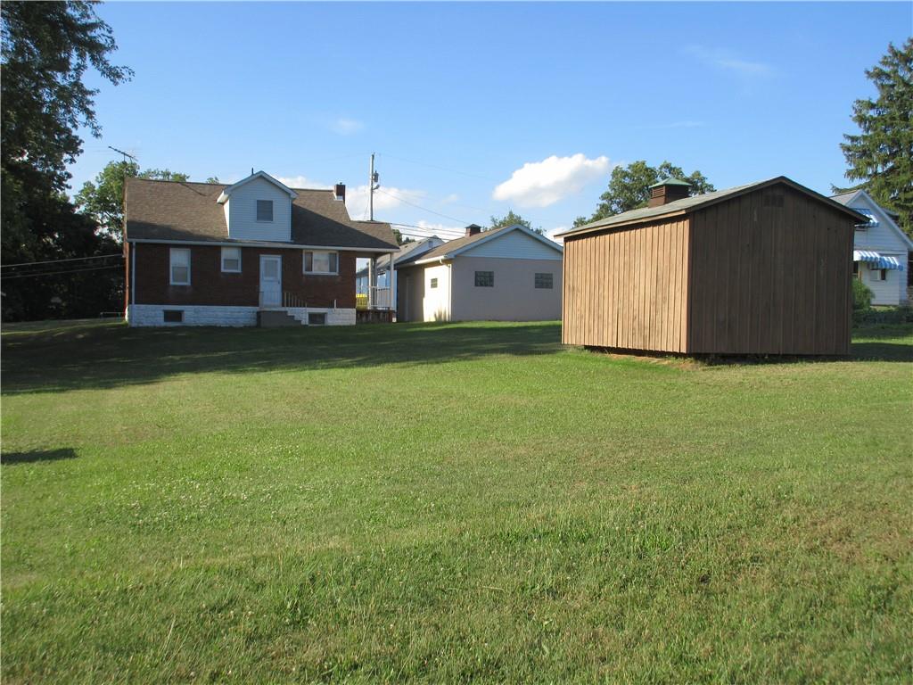 107 Blakely Road Butler, PA 16002 - Photo 20 of 25 a front view of a house with a yard and garage