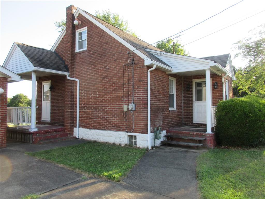 107 Blakely Road Butler, PA 16002 - Photo 2 of 25 a view of a house with backyard and a garden