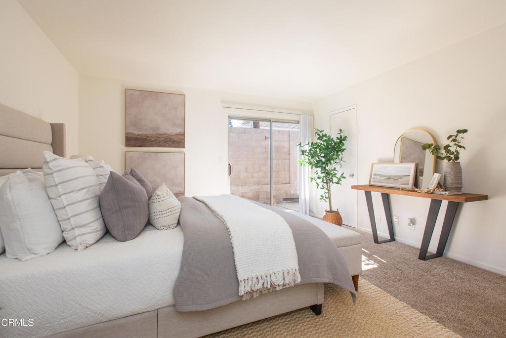 17516 Via Calma, Unit 39 Tustin, CA 92780 - Photo 13 of 29 a bedroom with a bed and window