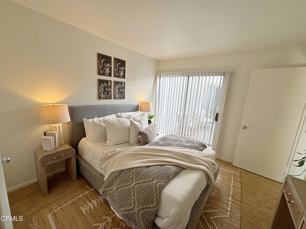 17516 Via Calma, Unit 39 Tustin, CA 92780 - Photo 20 of 29 a bedroom with a bed and a window