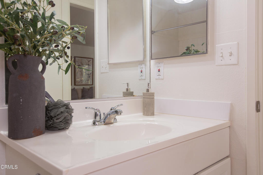 17516 Via Calma, Unit 39 Tustin, CA 92780 - Photo 24 of 29 a bathroom with a sink and a mirror
