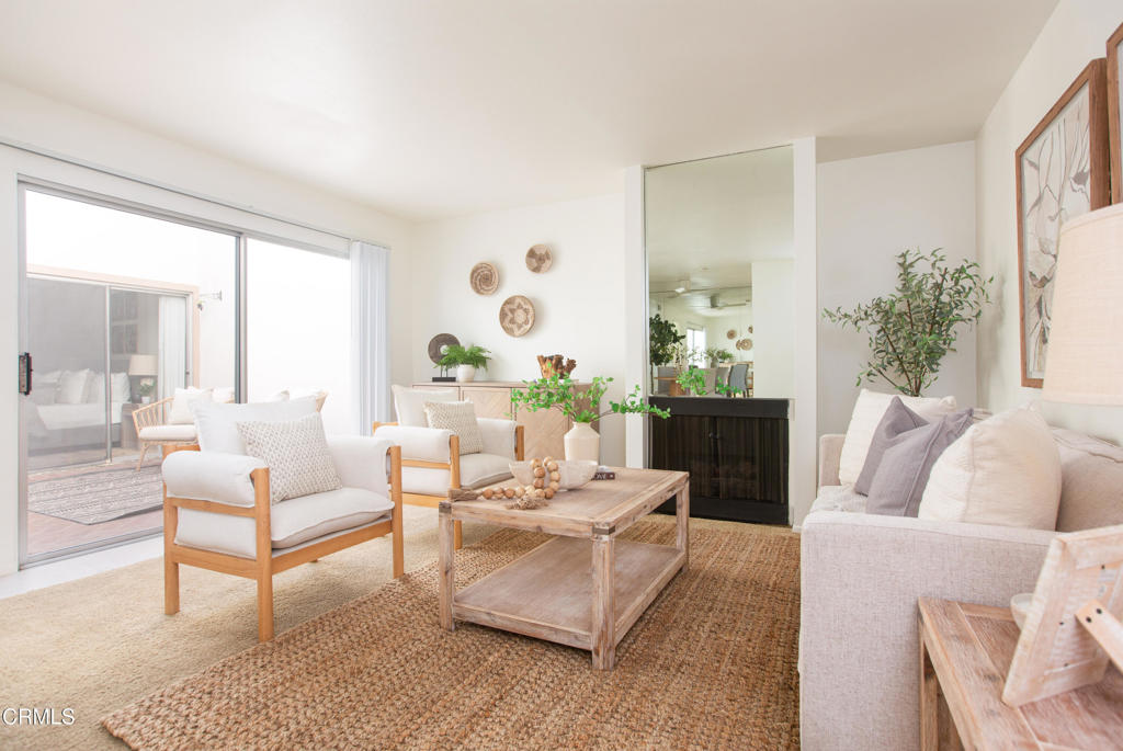 17516 Via Calma, Unit 39 Tustin, CA 92780 - Photo 3 of 29 a living room with furniture and a large window