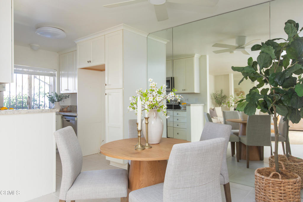 17516 Via Calma, Unit 39 Tustin, CA 92780 - Photo 6 of 29 a dining room with furniture and a potted plant