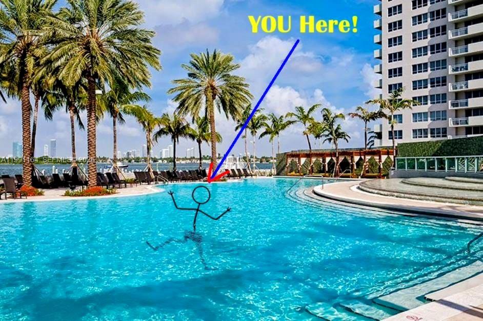 1500 Bay Road, Unit 854S Miami Beach, FL 33139 - Photo 19 of 20 a view of swimming pool with a table and chairs