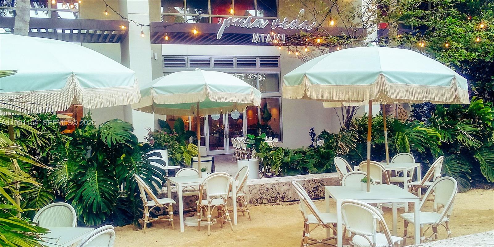 1500 Bay Road, Unit 854S Miami Beach, FL 33139 - Photo 6 of 20 a view of outdoor dining space with a patio and plants