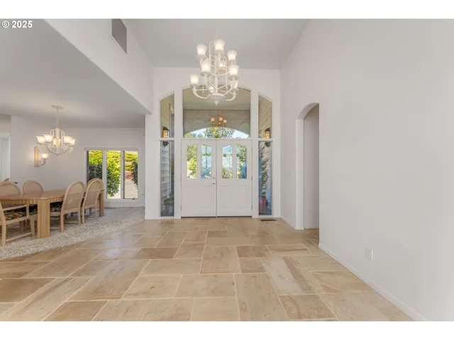 view of a dining room with furniture and chandelier