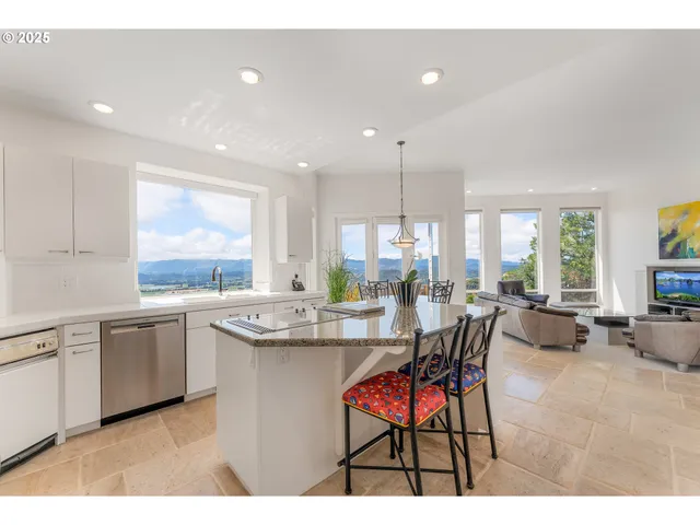 a kitchen with sink and view living room
