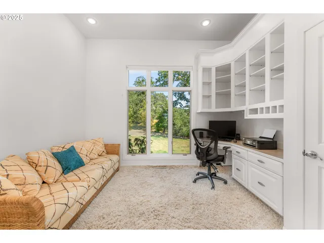 a workspace with furniture and a window