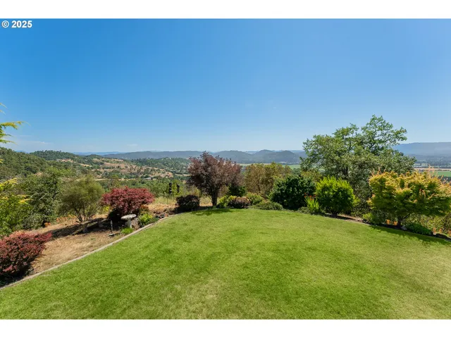 a view of a field with an outdoor space