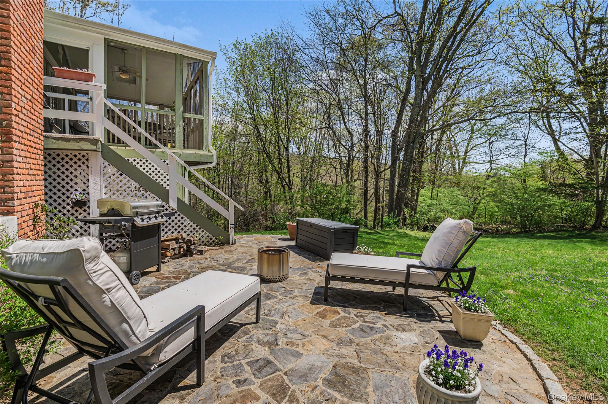 41 Cross Pond Road Pound Ridge, NY 10576 - Photo 38 of 41 a view of a patio with couple of chairs and a tables