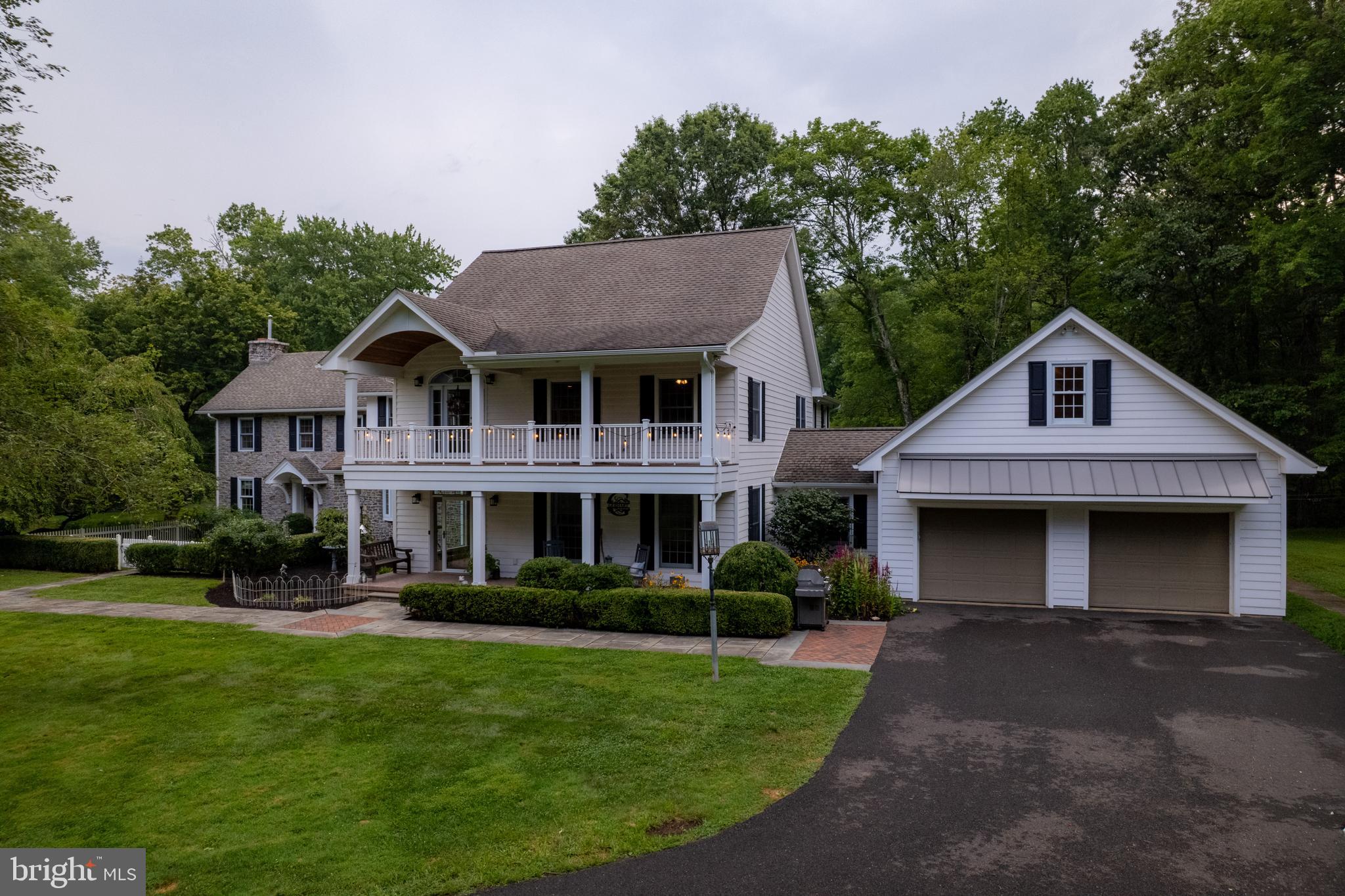 1627 East Saw Mill Road Quakertown, PA 18951 - Photo 14 of 61 a front view of a house with a garden and plants