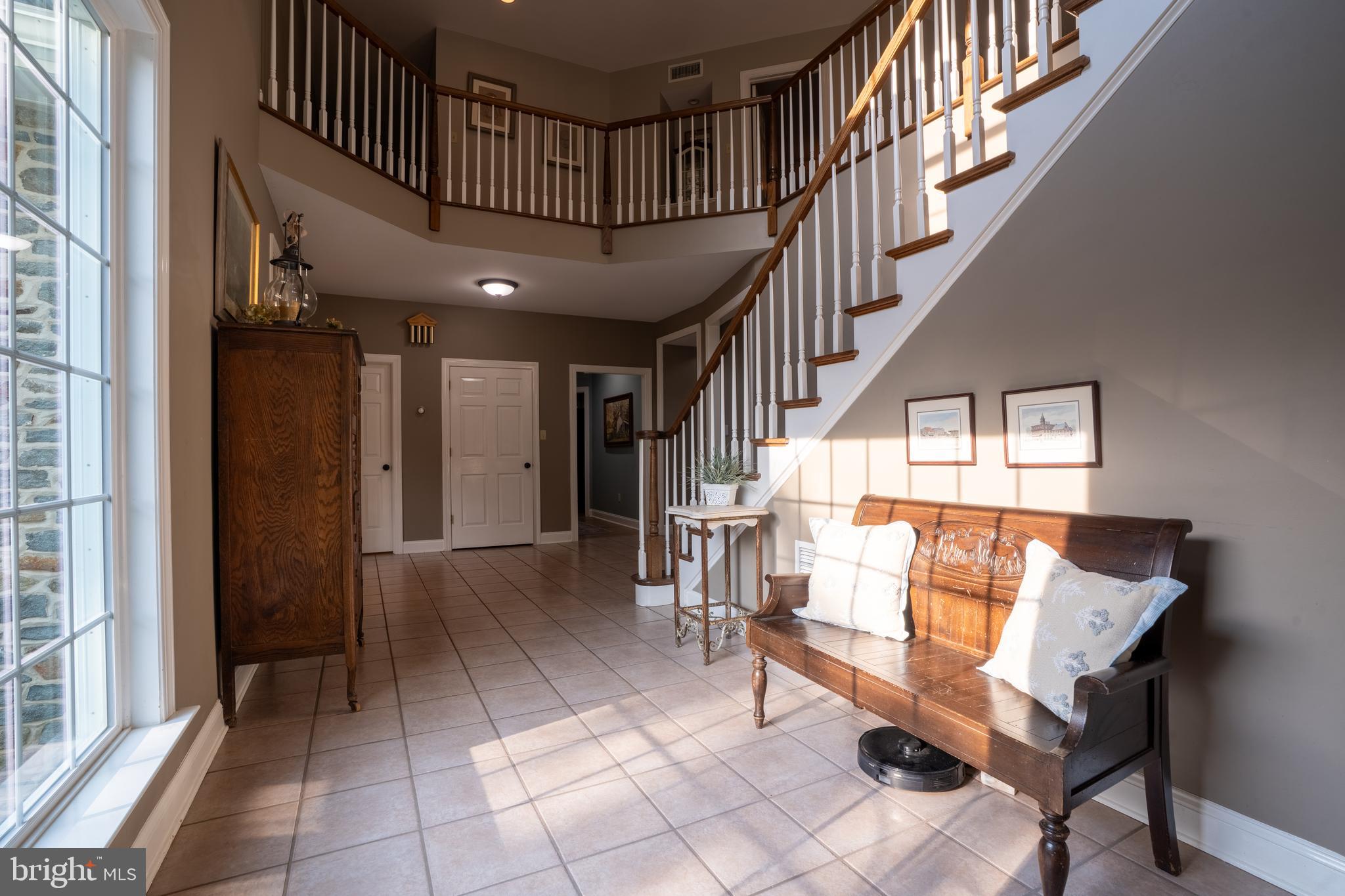 1627 East Saw Mill Road Quakertown, PA 18951 - Photo 17 of 61 a view of entryway dining room and hall with wooden floor