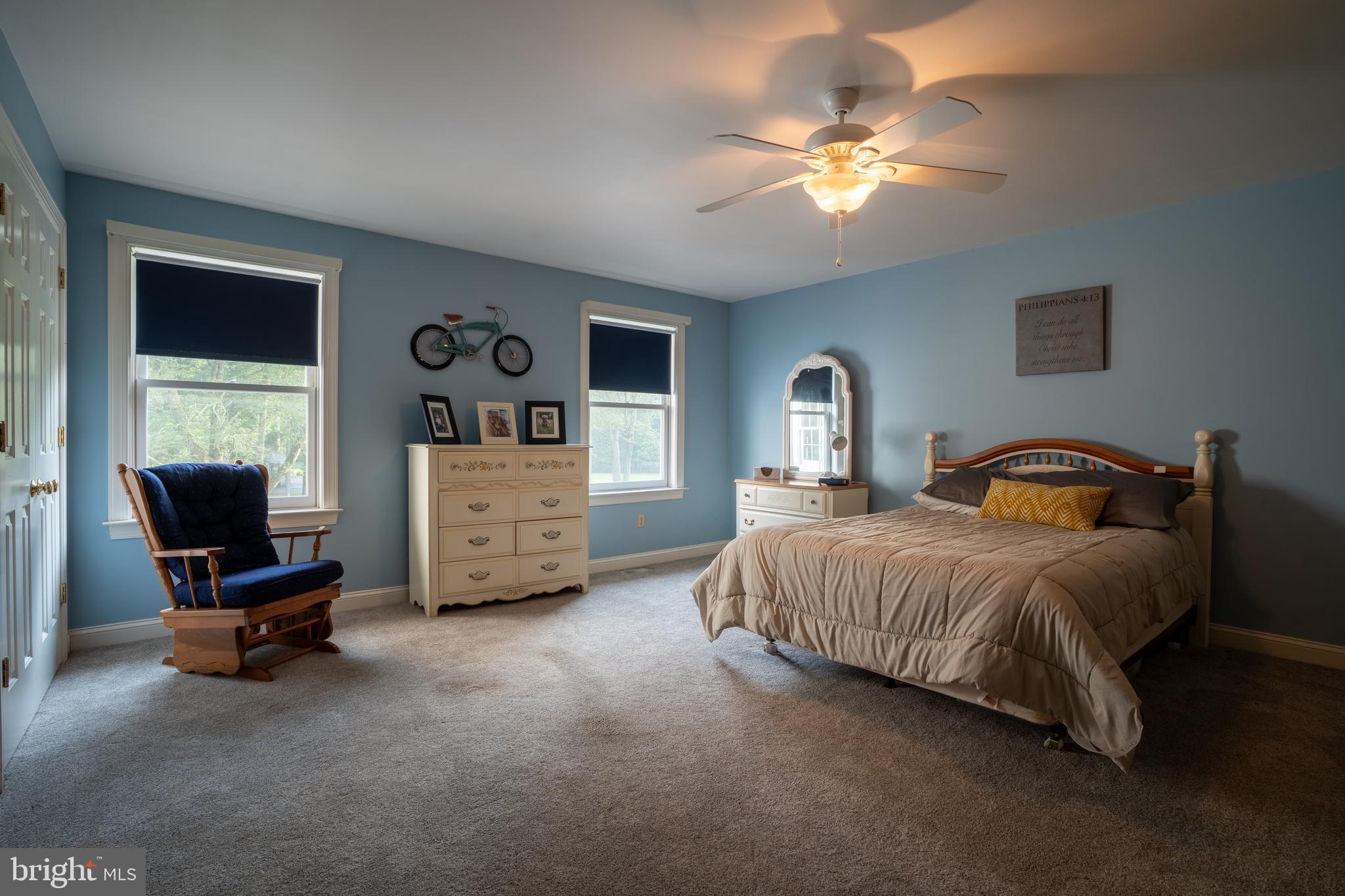 1627 East Saw Mill Road Quakertown, PA 18951 - Photo 50 of 61 a bedroom with a bed and a chandelier