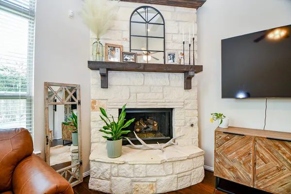 a living room with furniture and a fireplace