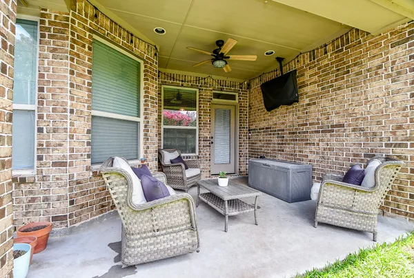 a view of patio with couple of couch and a couch