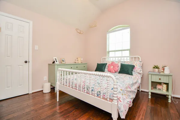 a bedroom with a bed and a fireplace