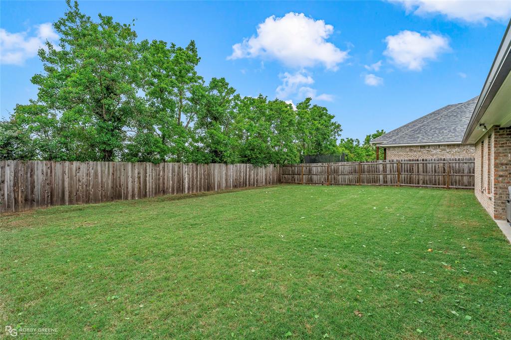 122 Brimestone Loop Benton, LA 71006 - Photo 27 of 33 a view of a backyard with a garden