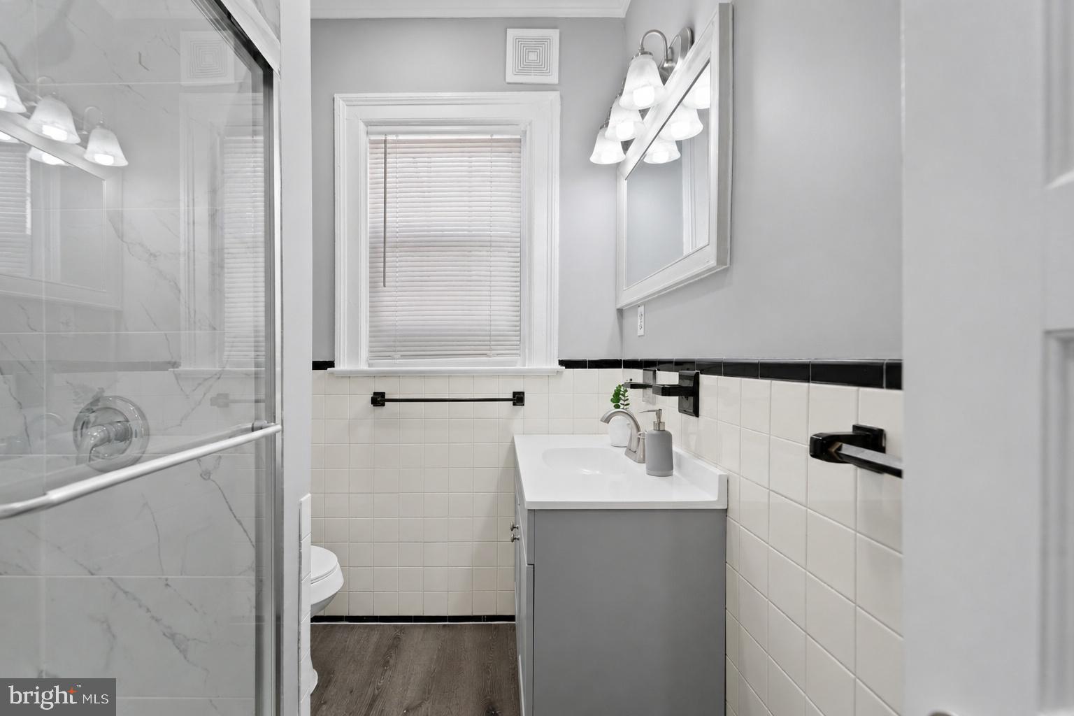 2808 Chelsea Terrace Baltimore, MD 21216 - Photo 11 of 29 Modern elegance in a cozy bathroom.