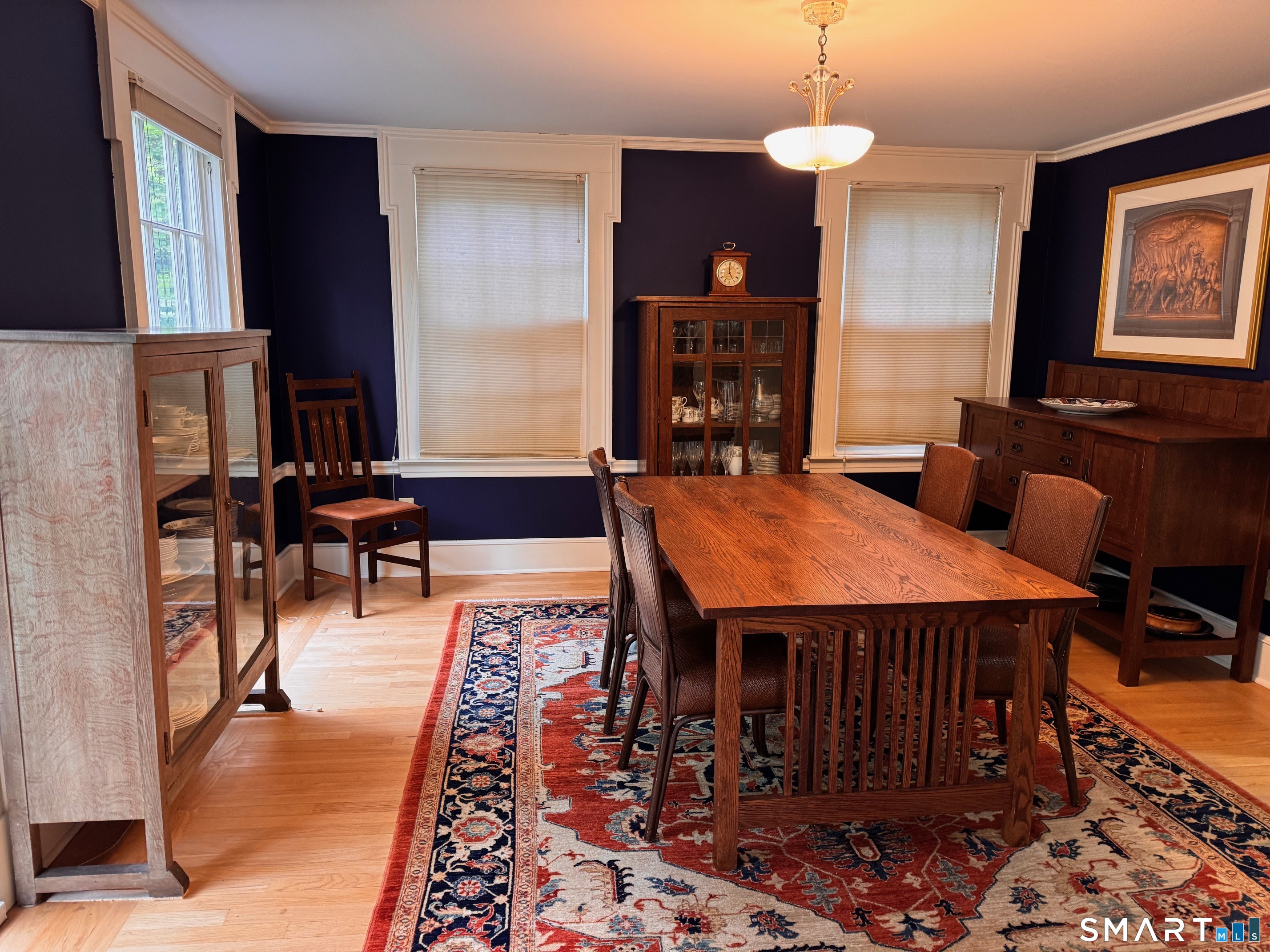 57 Mill Rock Road Hamden, CT 06517 - Photo 8 of 24 a dining room with a table and chairs