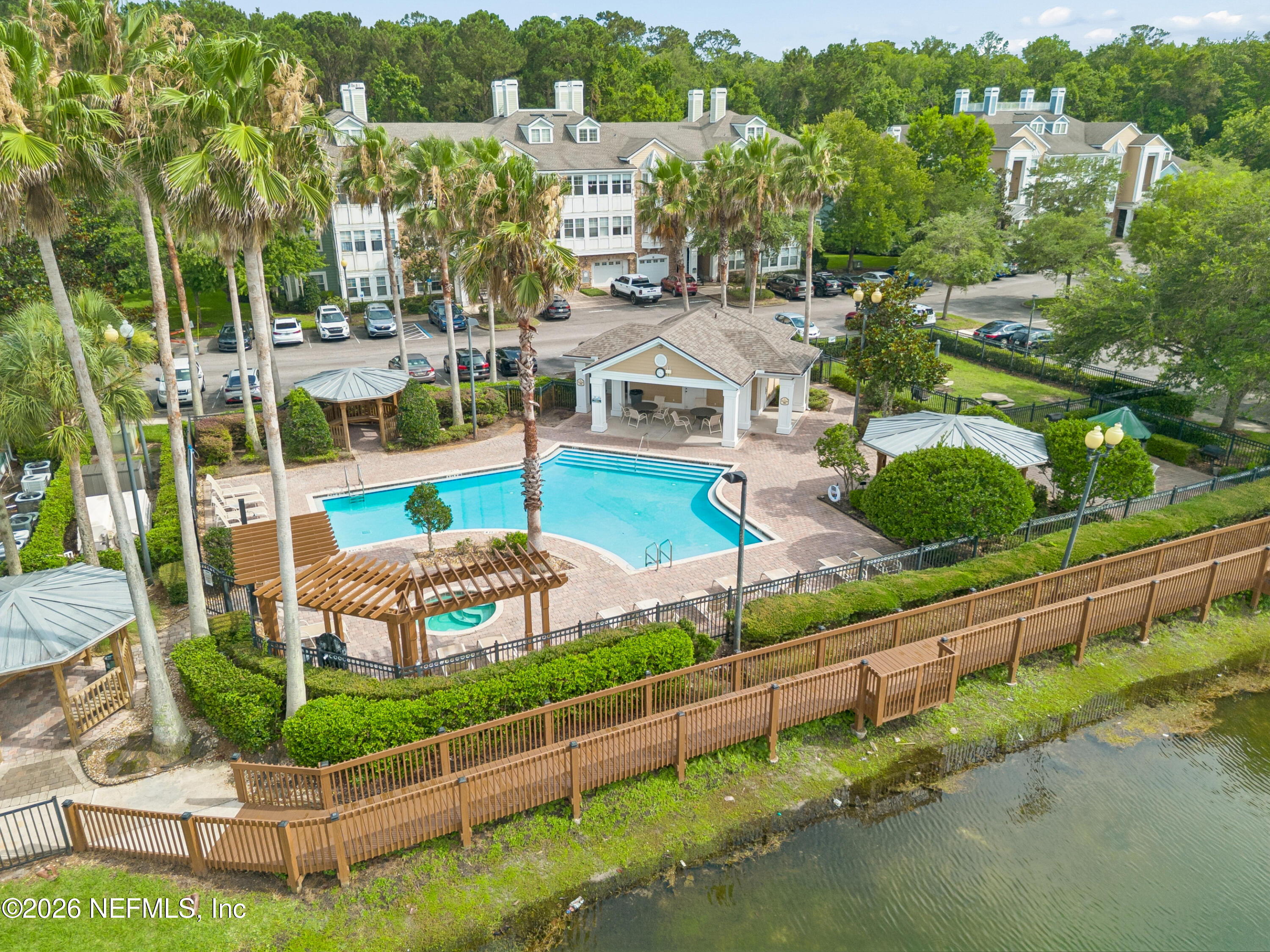 8550 Touchton Road, Unit 511 Jacksonville, FL 32216 - Photo 40 of 63 an aerial view of a house with a garden and outdoor space