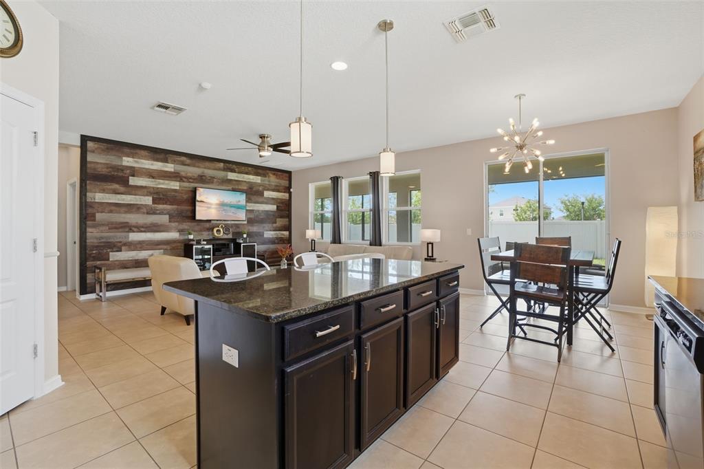 3933 Wind Dancer Circle St. Cloud, FL 34772 - Photo 13 of 35 a kitchen with a counter top space appliances and cabinets
