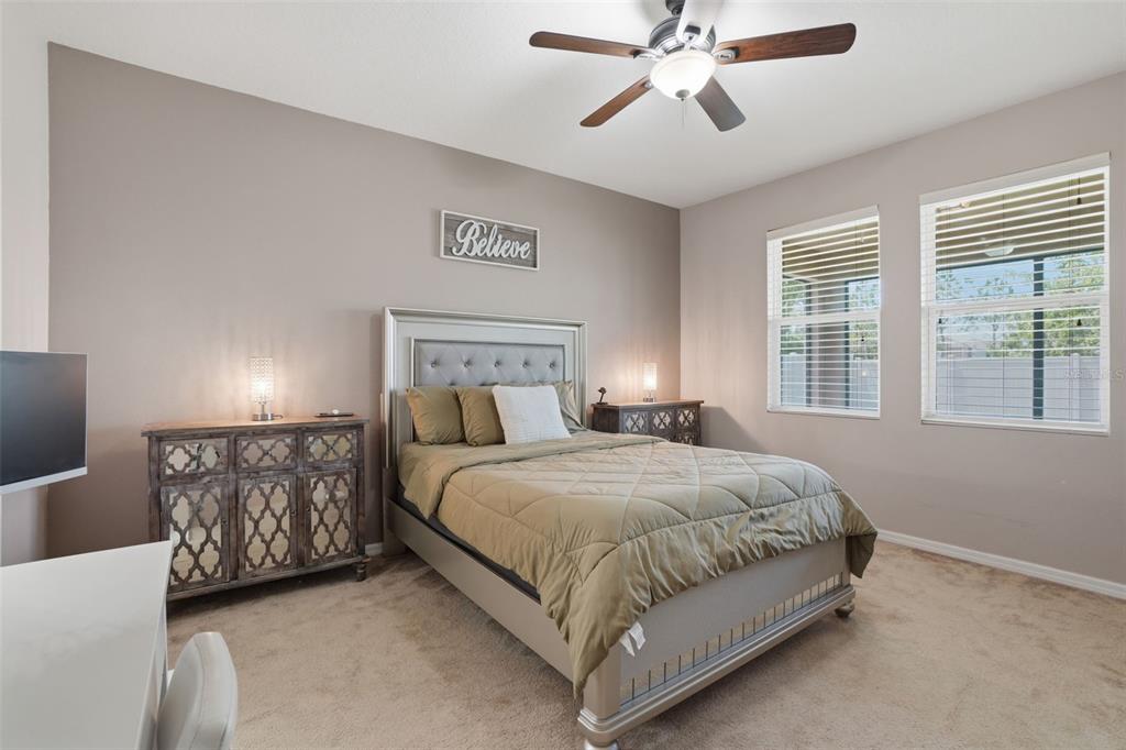3933 Wind Dancer Circle St. Cloud, FL 34772 - Photo 16 of 35 a bedroom with a bed and window