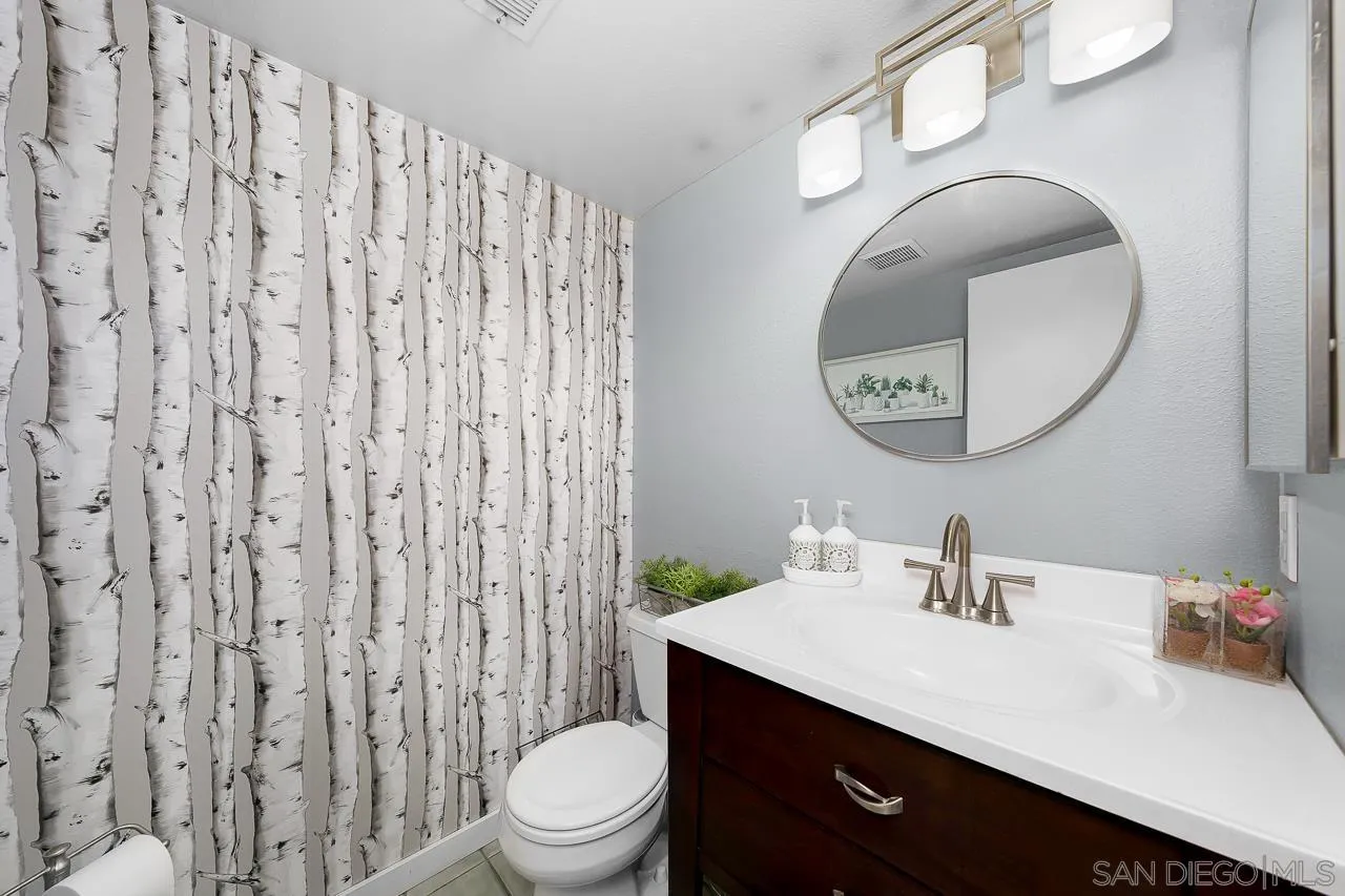10366 Rochelle Avenue Santee, CA 92071 - Photo 15 of 28 a bathroom with a sink vanity mirror and toilet