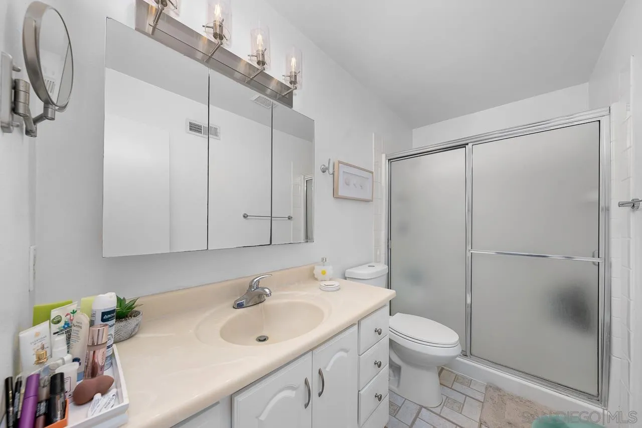 10366 Rochelle Avenue Santee, CA 92071 - Photo 19 of 28 a bathroom with a sink toilet and shower