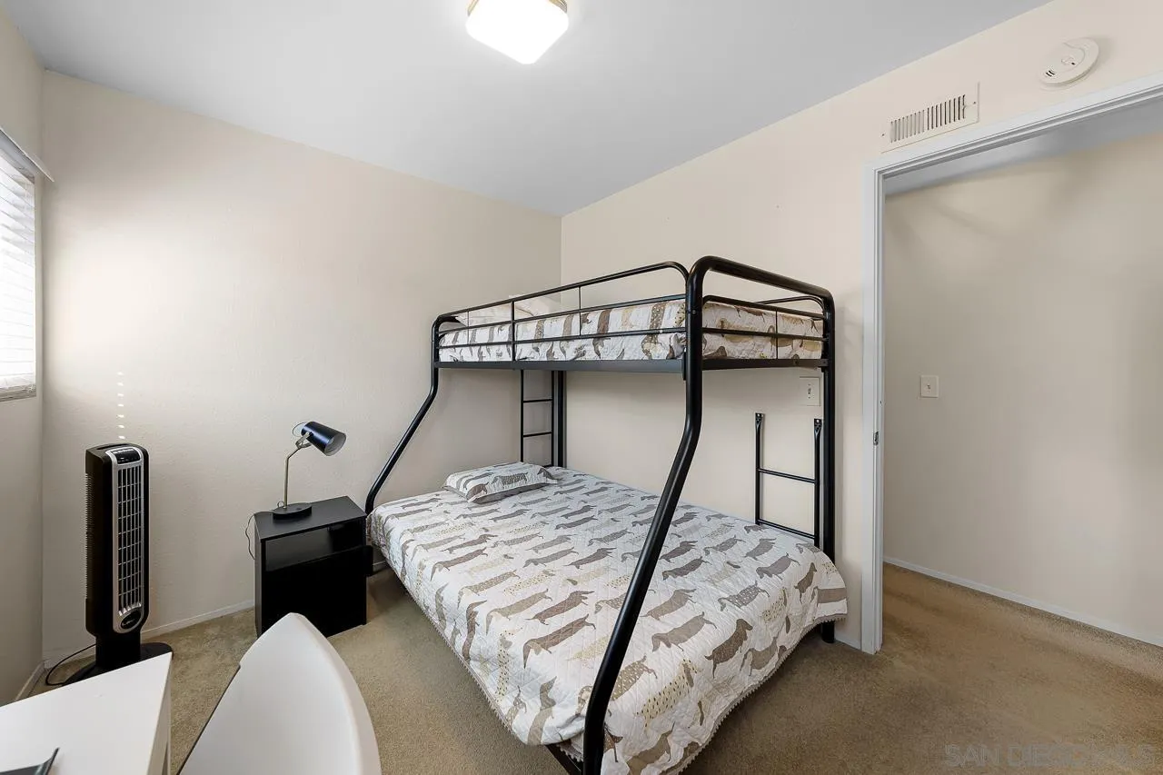 10366 Rochelle Avenue Santee, CA 92071 - Photo 20 of 28 a bedroom with a bed and a chandelier