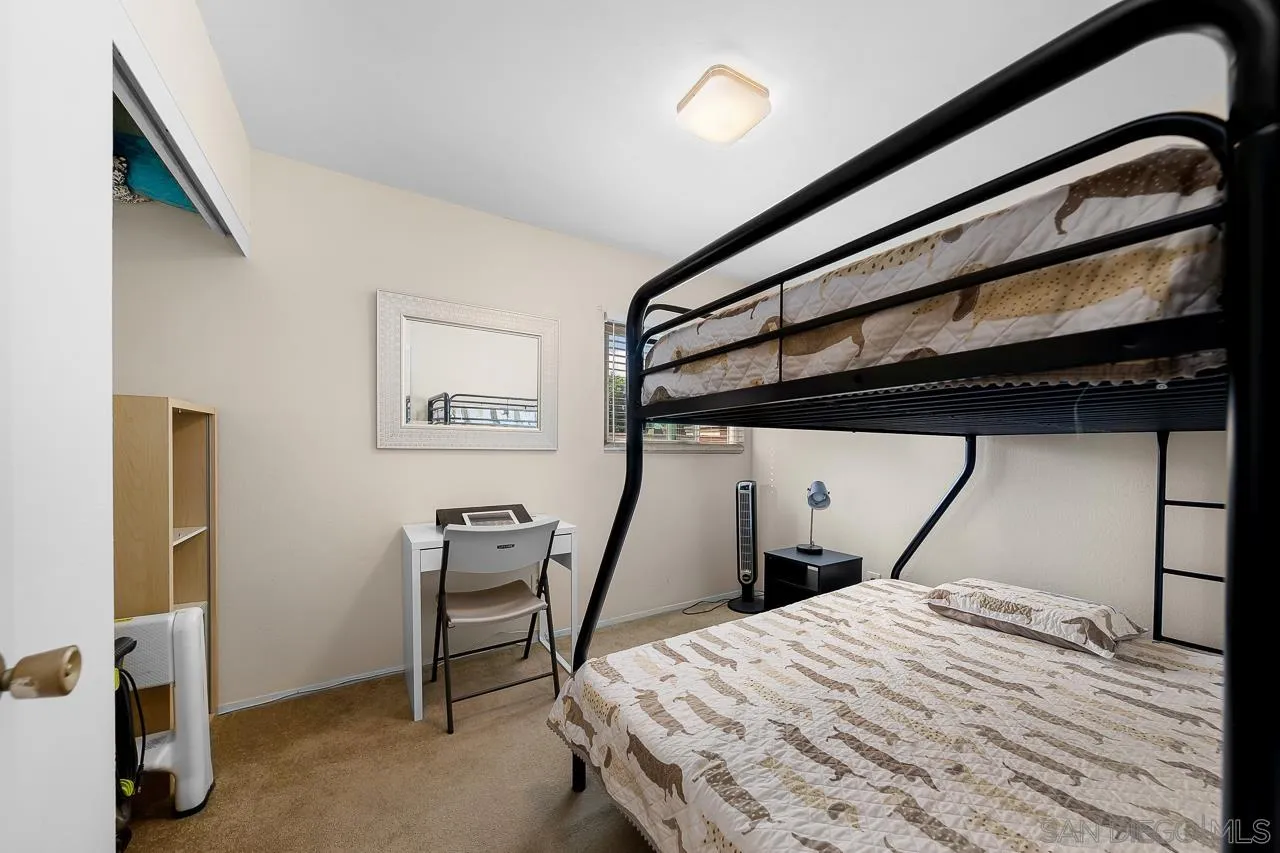 10366 Rochelle Avenue Santee, CA 92071 - Photo 21 of 28 a bedroom with a bed and a mirror