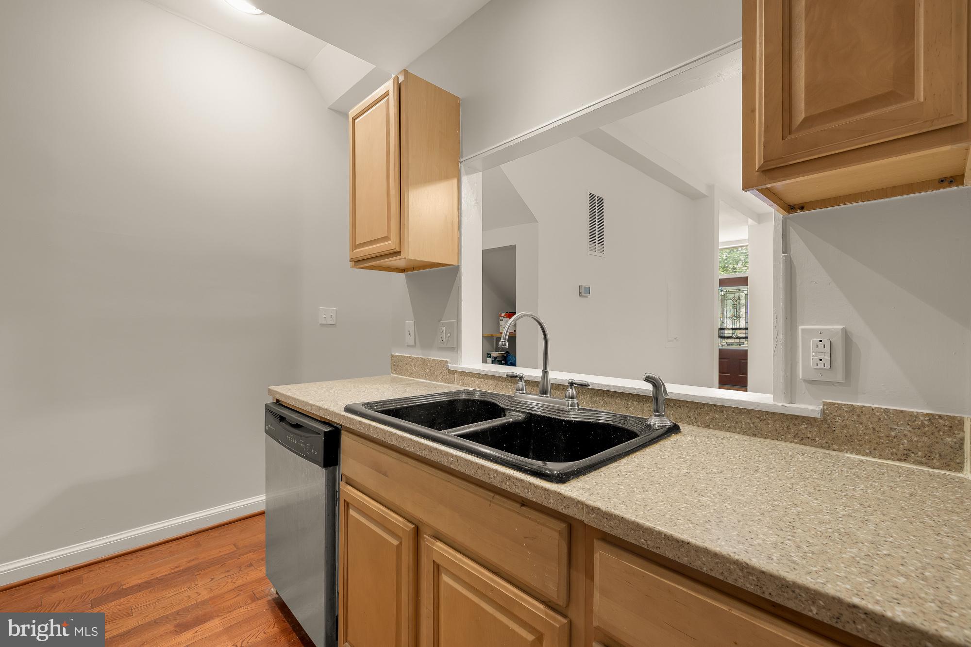 601 L Street Northeast Washington, DC 20002 - Photo 14 of 47 a kitchen with a sink and a stove