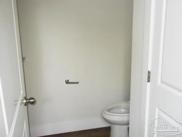 a bathroom with a toilet and a sink