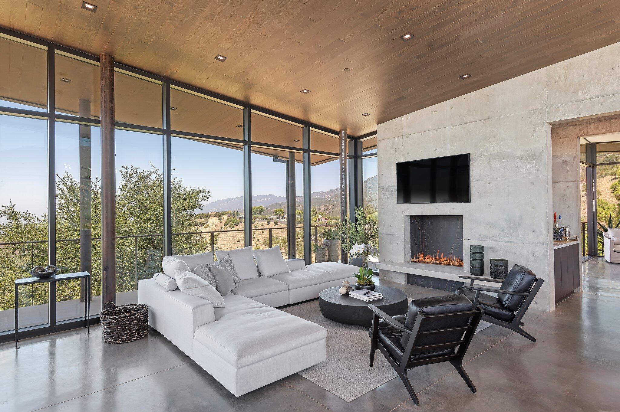 2805 Spyglass Ridge Road Santa Barbara, CA 93105 - Photo 18 of 67 a living room with fireplace furniture and a flat screen tv