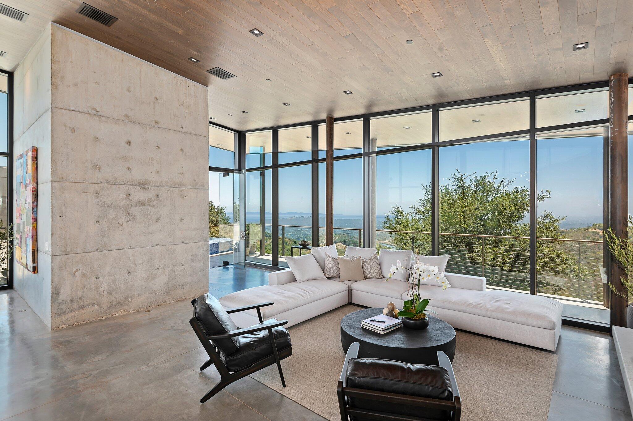 2805 Spyglass Ridge Road Santa Barbara, CA 93105 - Photo 20 of 67 a living room with furniture and a floor to ceiling window