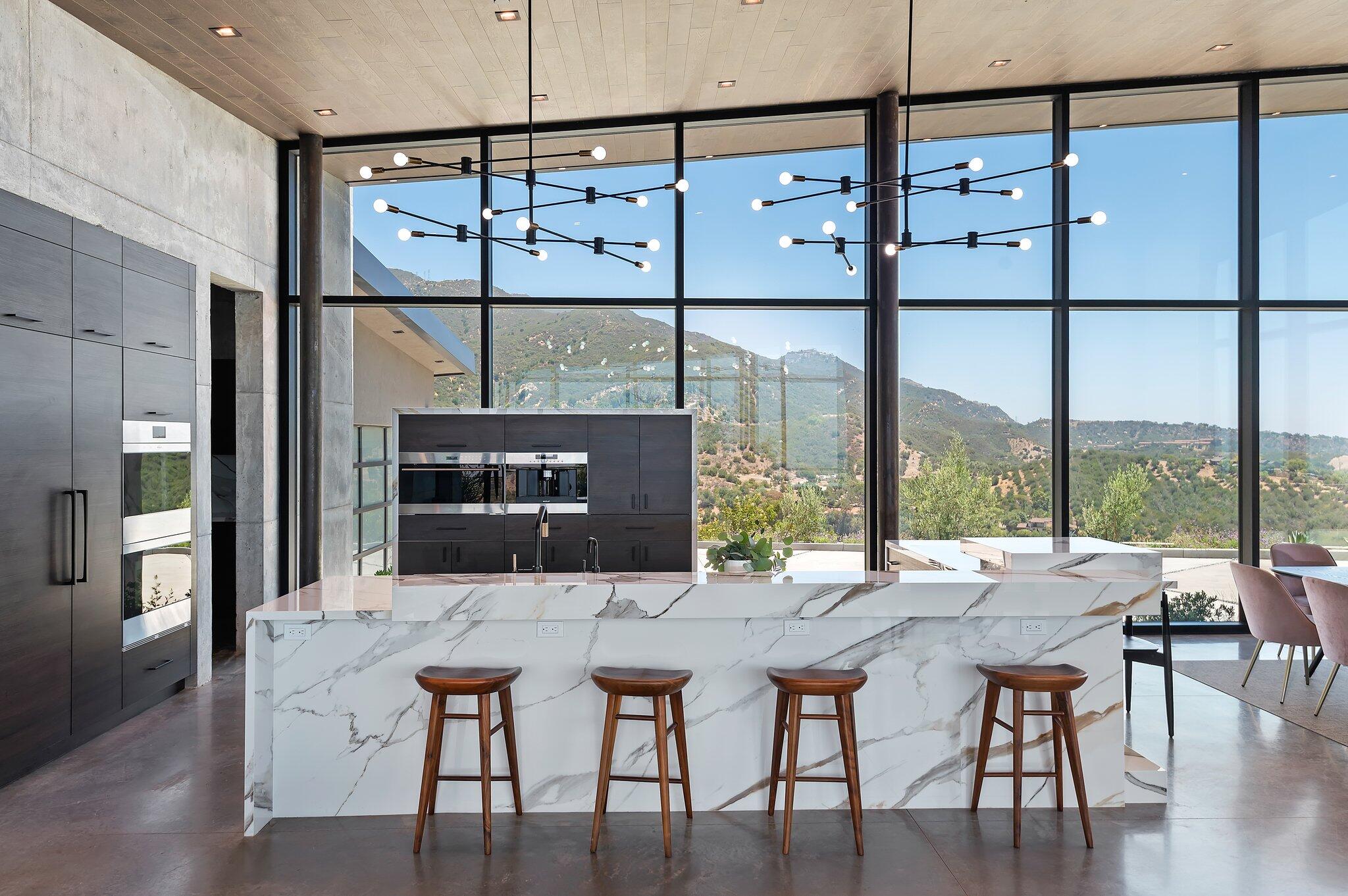 2805 Spyglass Ridge Road Santa Barbara, CA 93105 - Photo 22 of 67 a view of a dining room with furniture window and wooden floor