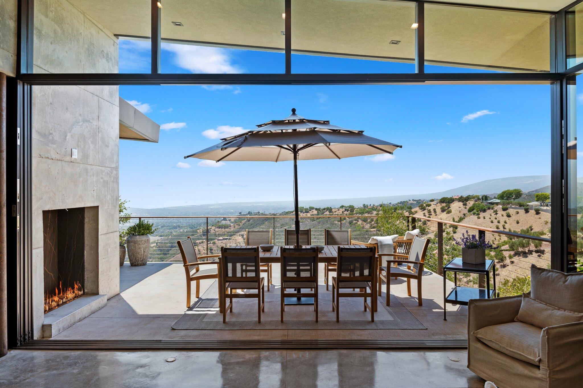 2805 Spyglass Ridge Road Santa Barbara, CA 93105 - Photo 28 of 67 a view of a dining room with furniture and chandelier