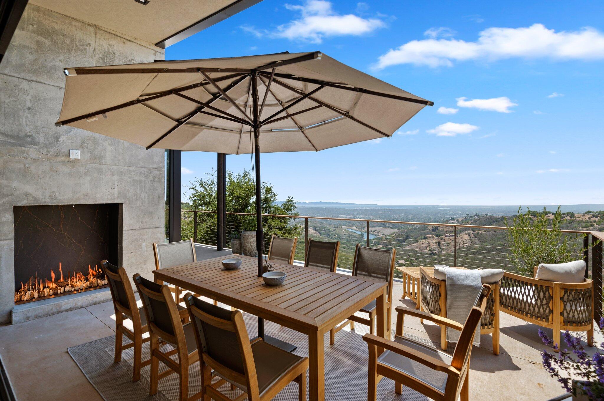 2805 Spyglass Ridge Road Santa Barbara, CA 93105 - Photo 29 of 67 a view of a terrace with furniture and umbrella